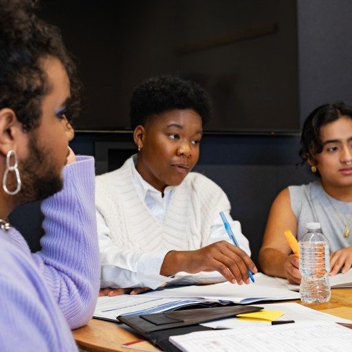 A group of co-workers of varying genders having a meeting