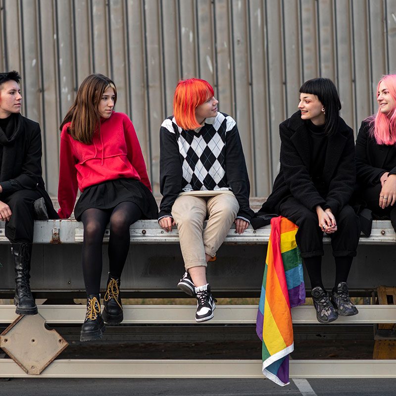 group-non-binary-friends-sitting-each-other